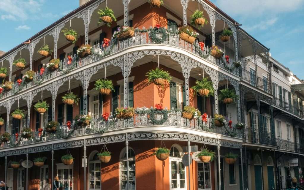Cast-iron gallery balconies with hanging plants in the French Quarter