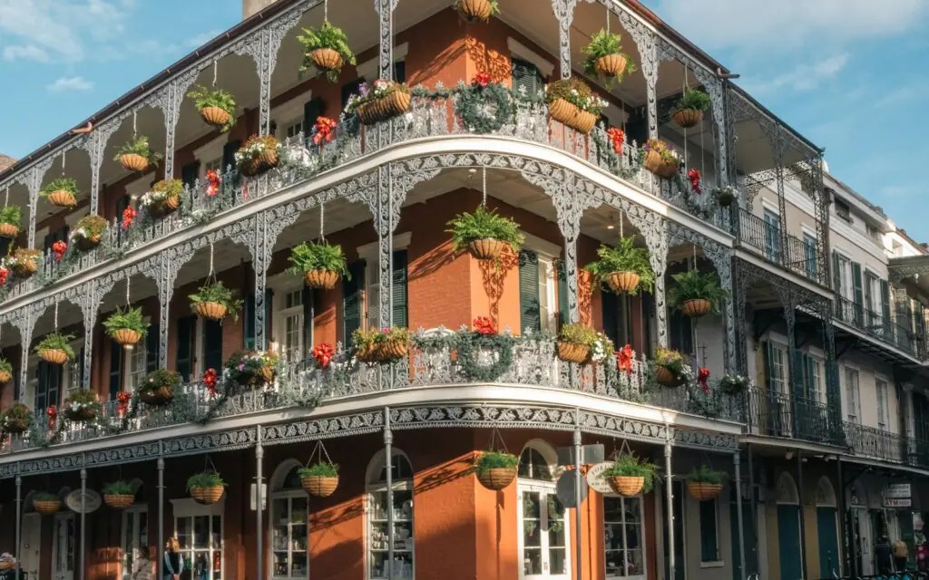 Cast-iron gallery balconies with hanging plants in the French Quarter